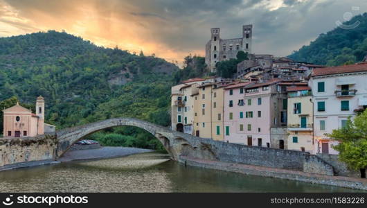 DOLCEACQUA, ITALY - CIRCA AUGUST 2020: Dolceacqua panorama with the ancient roman bridge made of stones and the castle