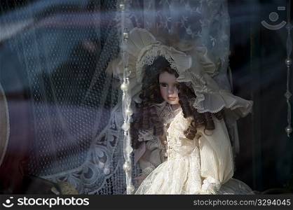 Doll in a window in downtown historic district of Branson, Missouri