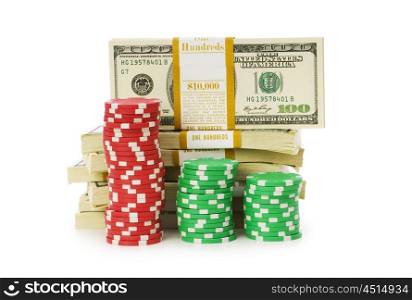Dollar and casino chip stacks on white