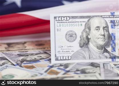 Dollar banknotes on American Flag
