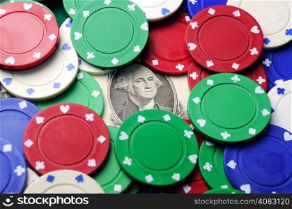 dollar bill under poker chips - economy concept