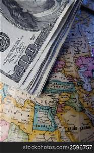 Dollar bills on a globe