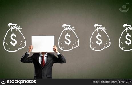 Dollar concept. Unrecognizable businessman holding paper covering his face