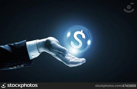 Dollar currency. Close up of human hand holding dollar symbol