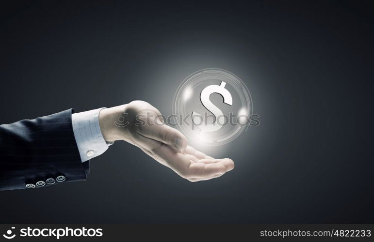 Dollar currency. Close up of human hand holding dollar symbol