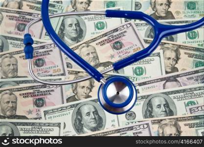 dollar currency notes and stehoskop. costs of health and medicine