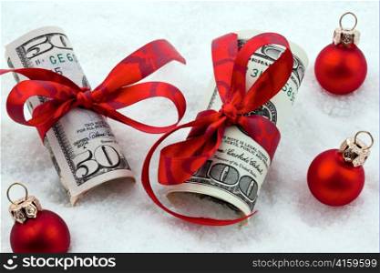 dollar currency notes for a gift. on a white background with red bow