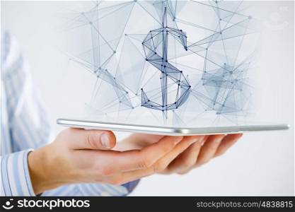 Dollar currency symbol. Hand holding tablet with digital grid dollar sign on screen