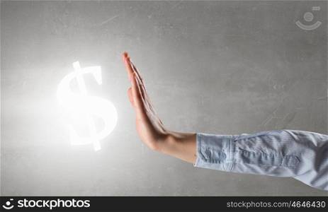 Dollar currency symbol. Male hand showing stop gesture and dollar glowing sign