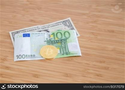 Dollar, euro and bitcoin banknote on the table