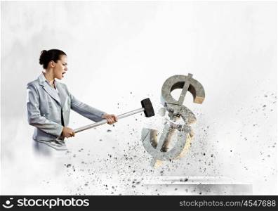 Dollar fall. Image of businesswoman breaking stone dollar symbol with hammer