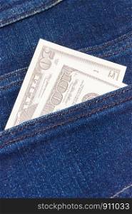 Dollar in back jeans pocket. Concept of cash paying for shopping. Dollar in jeans pocket. Cash paying for shopping concept