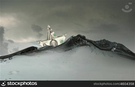 Dollar ship in water. Ship made of dollar banknote floating in water