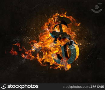 Dollar symbol in fire. Dollar currency sign burning in fire flames on dark background