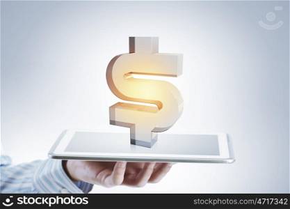 Dollar symbol on tablet screen. Businessman holding tablet with projected on screen dollar sign