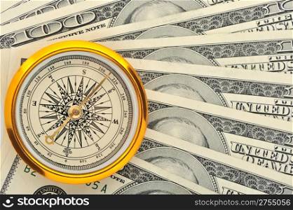 Dollars and compass. Concept about a direction in business
