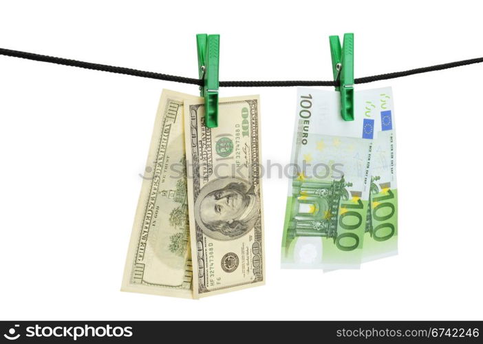 Dollars and euro hanging on a string isolated on a white.