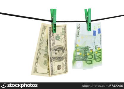 Dollars and euro hanging on a string isolated on a white.