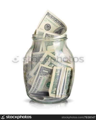 dollars bills in a glass jar isolated on white background