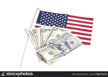 Dollars bills on American flag isolated on white