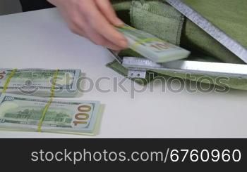 Dollars packs folded in cash collection bag and sealed