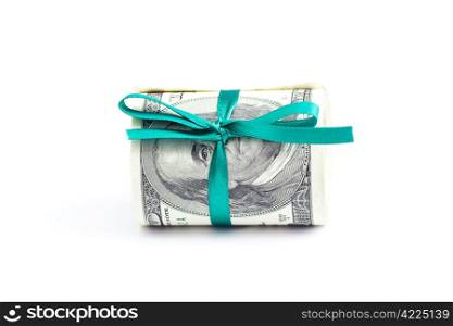 Dollars rolled into a tube tied with ribbon isolated on white