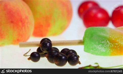 Dolly: Ice lolly with fresh fruit and berries close-up