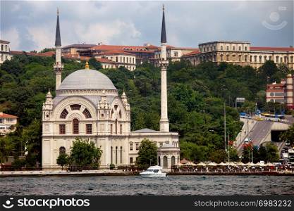 Dolmabahce Mosque Baroque style architecture, view from the Bosphorus Strait in Istanbul, Turkey.