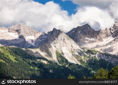 Dolomites Alps summer cloudy mountain valley, Italy
