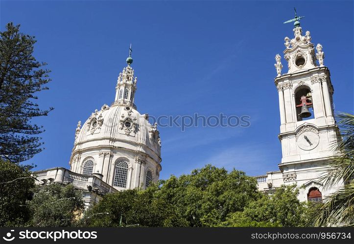 Dome and clock tower of the late Baroque and Neo-Classical Royal Basilica and Convent of the Most Sacred Heart of Jesus, built in late 18th century in Lisbon, Portugal