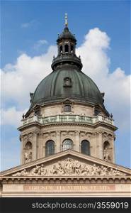 Dome and decorated with sculptures tympanum of the St. Stephen&rsquo;s Basilica in Budapest, Hungary.