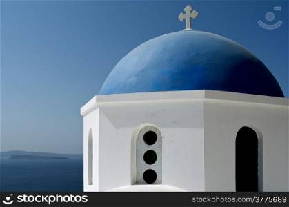 Dome of a church in Oia on Santorini island in Greece.