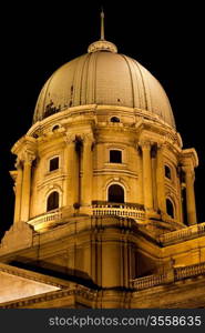 Dome of the Royal Palace illuminated at night in Budapest, Hungary, Neo-Classical style.