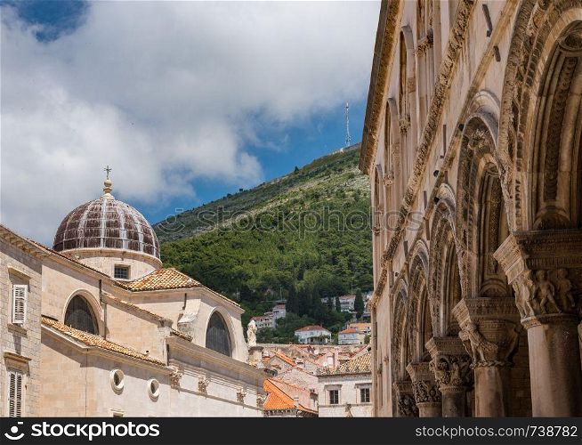 Dome on St Blaise church with Rector's palace entrance in the old town of Dubrovnik in Croatia. Details of roof of St Blaise church in Dubrovnik old town