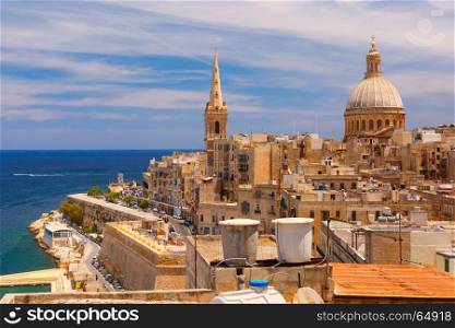 Domes and roofs of Valletta , Malta. View from above of roofs and church of Our Lady of Mount Carmel and St. Paul's Anglican Pro-Cathedral, Valletta, Capital city of Malta