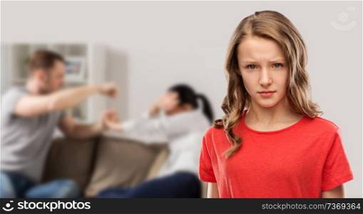 domestic violence, assault and social issue concept - unhappy teenage girl in red t-shirt over her mother and father having fight on background. unhappy girl over her parents having fight