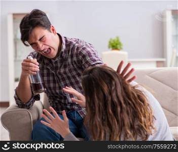 Domestic violence concept in a family argument with drunk alcoholic husband. Domestic violence concept in a family argument with drunk alcoho