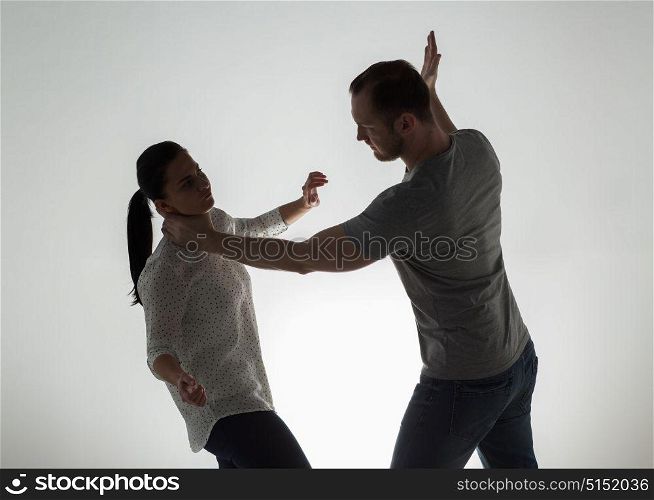 domestic violence, people and abuse concept - couple having fight and man choking woman. couple having fight and man choking woman
