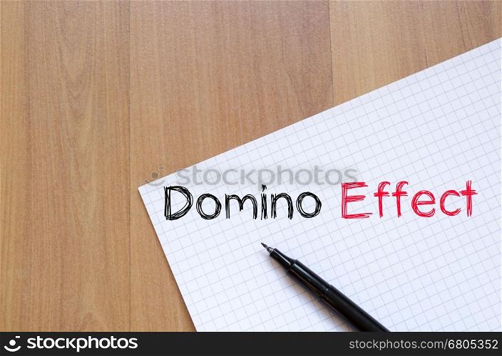 Domino effect text concept write on notebook