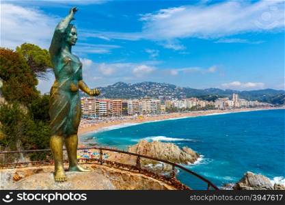 Dona marinera, monument to the Fishermans Wife one of the towns most emblematic symbols at popular holiday resort Lloret de Mar on Costa Brava in the morning , Catalunya, Spain