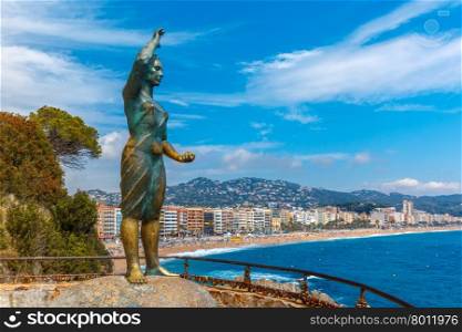 Dona marinera, monument to the Fishermans Wife one of the towns most emblematic symbols at popular holiday resort Lloret de Mar on Costa Brava in the morning , Catalunya, Spain