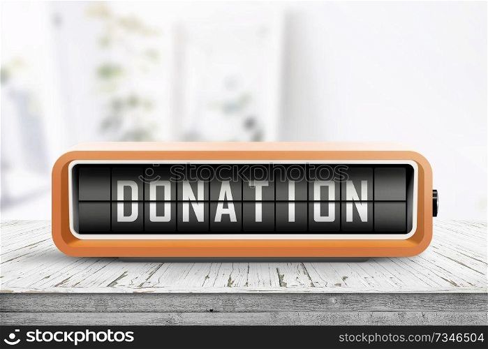 Donation message on a retro alarm clock on a table in a bright living room