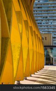 Donau City, Vienna, / Austria - 01, August 2013: View at Modern yellow wooden sculpture Austria Center in Donau City. Closeup view architecture. Modern yellow wooden sculpture Austria Center