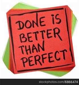 Done is better than perfect reminder - handwriting in black ink on an isolated sticky note