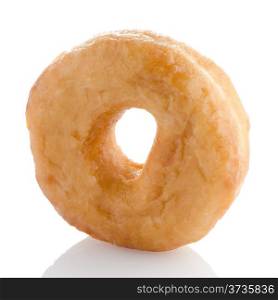 Donut on a white reflective background.