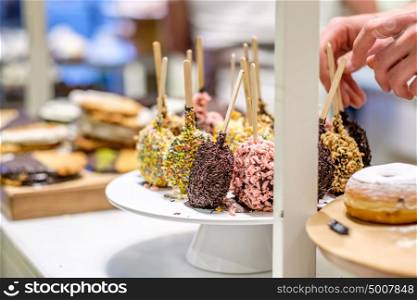 Donuts in assortment at confectionery store