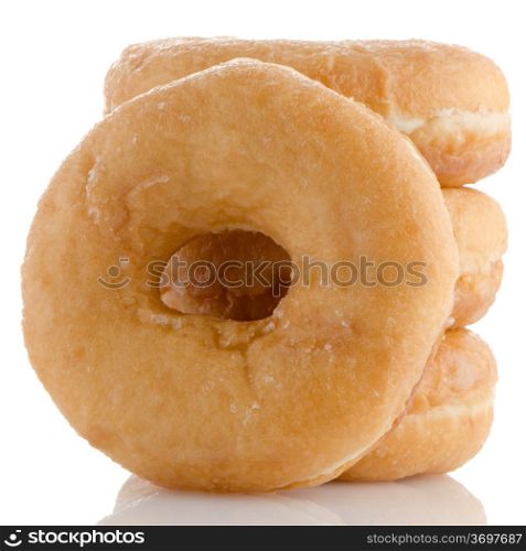 Donuts on a white reflective background.