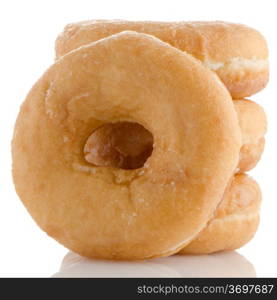 Donuts on a white reflective background.