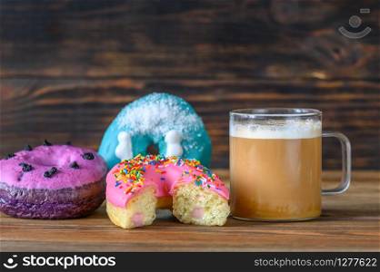 Donuts with a cup of coffee close-up
