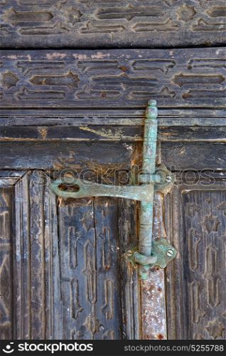 door abstract spain canarias brass brown knocker in a green closed wood lanzarote